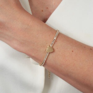Pulseira riviera baguete cristal com coração liso banhado em ouro 18k