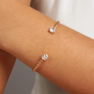 Bracelete trançado com zircônias redondas cristal banhado em ouro 18k