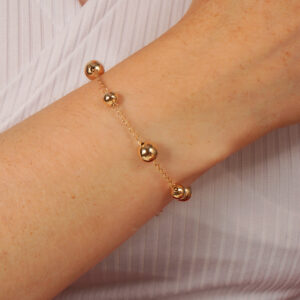 Pulseira bolas lisas espaçadas banhado em ouro 18k